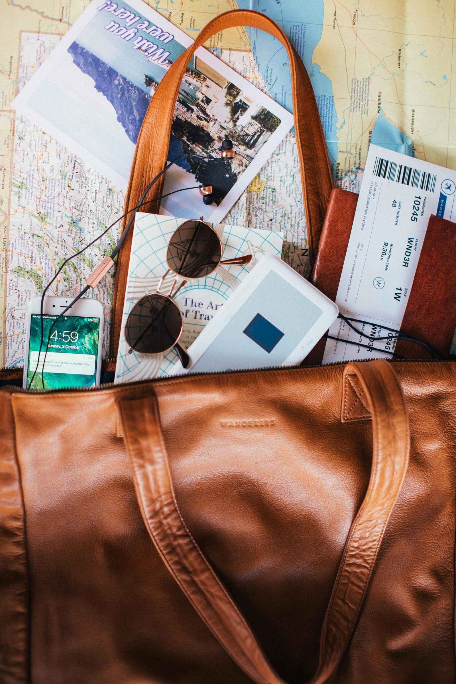 An Open Bag with Maps and Tickets