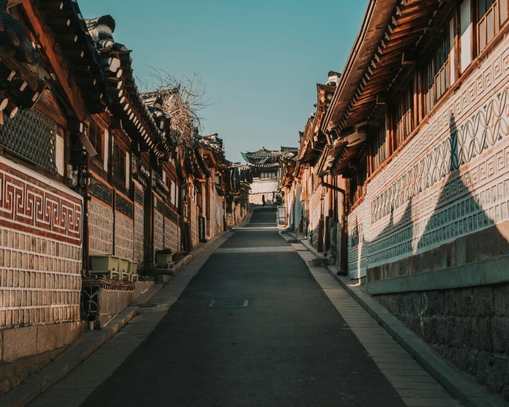 A Long Concrete Road Between Houses